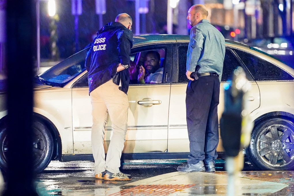 Members of the US Secret Service speak to the driver of the vehicle that crashed into a parked SUV that was guarding President Joe Biden ‘s motorcade. Photo: Reuters