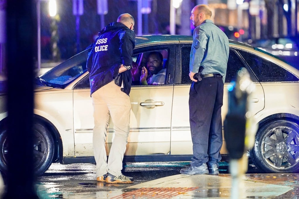 Members of the US Secret Service speak to the driver of the vehicle that crashed into a parked SUV that was guarding President Joe Biden ‘s motorcade. Photo: Reuters
