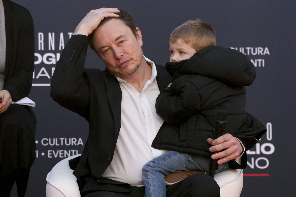 Tesla CEO Elon Musk, holding his son, attends the annual political festival Atreju in Rome on December 16. Photo: AP