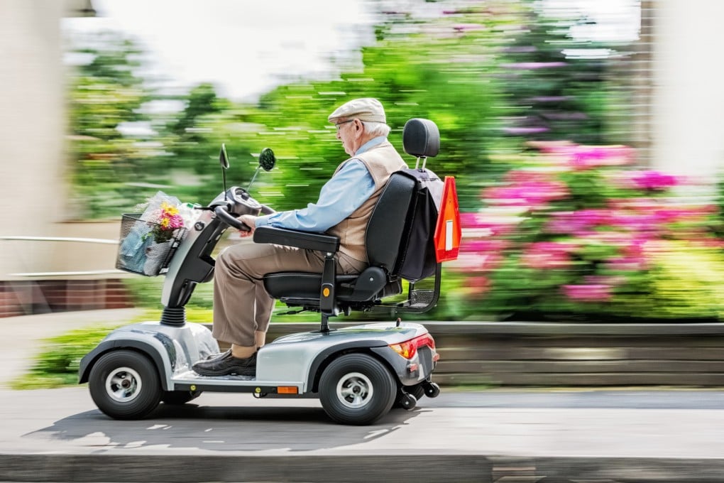 An elderly man drives a mobility scooter. Mobility units such as scooters and motorised wheelchairs are intended to carry people who have difficulty walking. Photo: Shutterstock