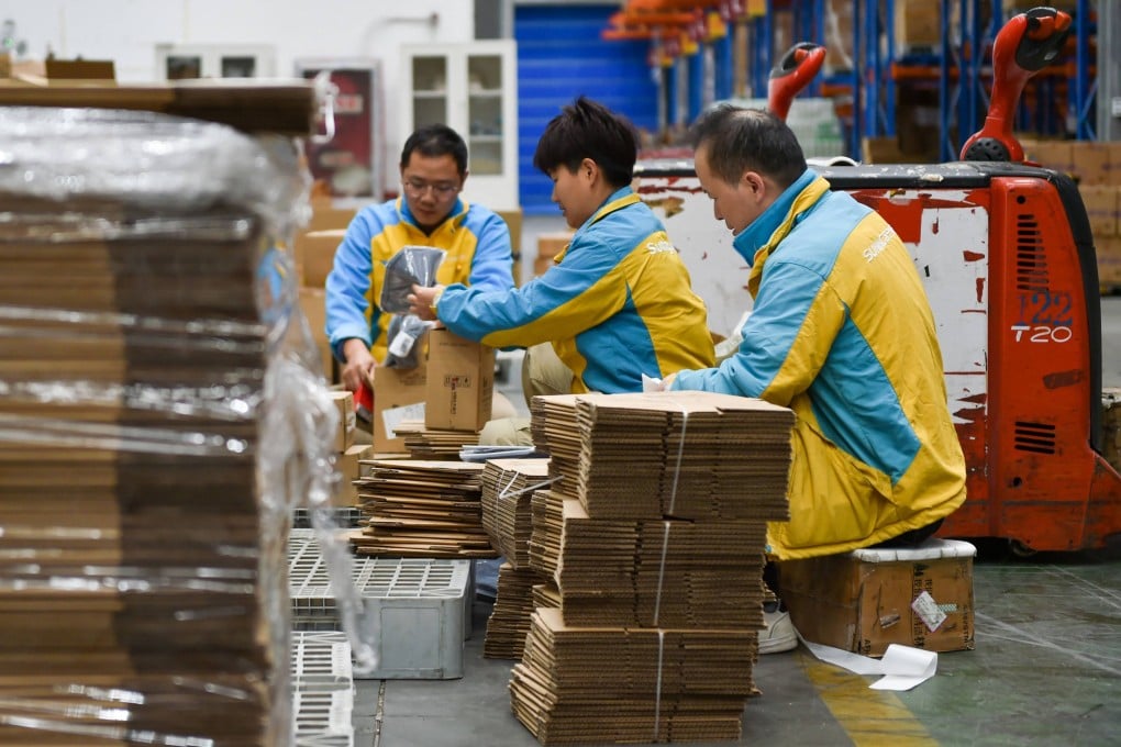 Workers prepare packages for delivery ahead of the Singles Day shopping festival at a logistics center in Nanjing, in China’s eastern Jiangsu province on November 10, 2023. Photo: AFP