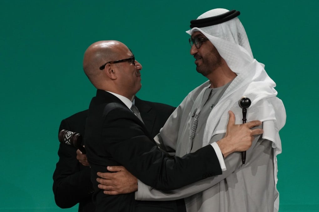 United Nations climate chief Simon Stiell embraces Cop28 president Sultan al-Jaber after the final gavel at the UN climate summit on December 13 in Dubai. Photo: AP