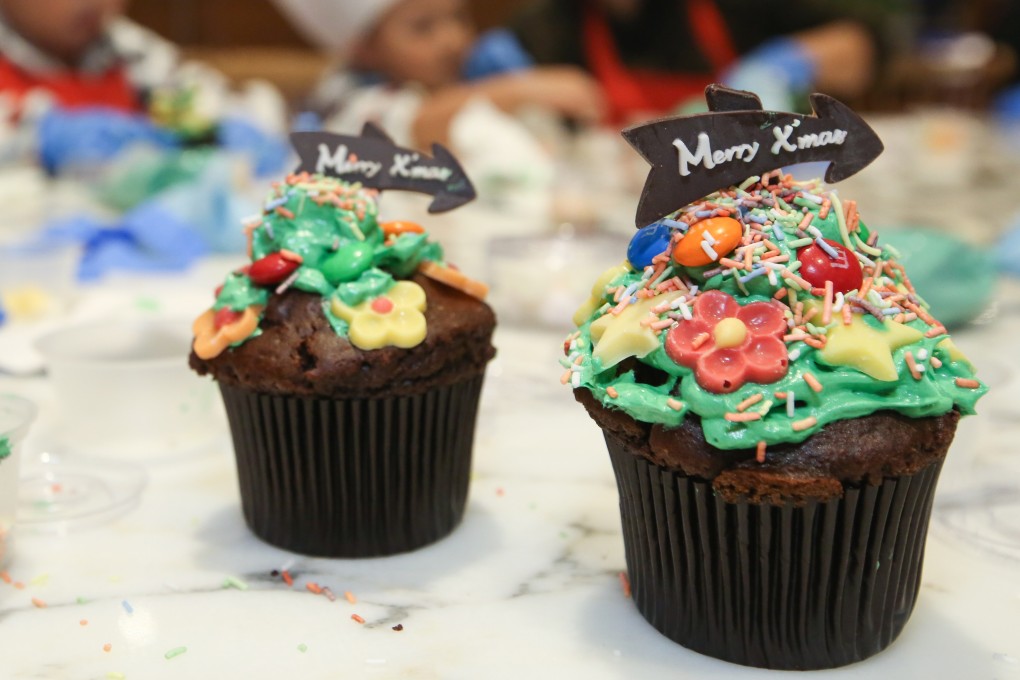Cup cakes decorated with Christmas greetings. A previous directive had prevented bakeries in Malaysia with halal certificates from putting food items with festive greetings on display. Photo: Edmond So