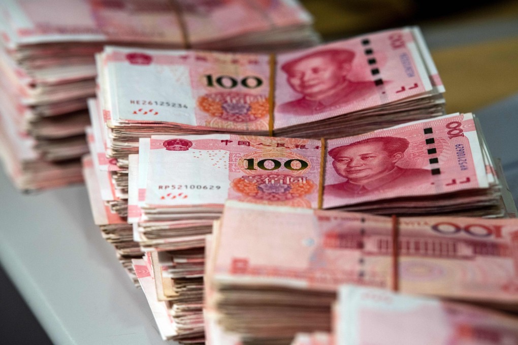 Bundles of 100 yuan notes. Singapore police have received more than 670 reports of remittances being frozen in China, with about US$9.8 million of funds affected. Photo: AFP
