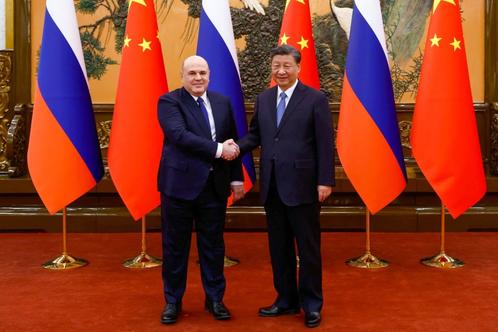 Chinese President Xi Jinping with Russian Prime Minister Mikhail Mishustin ahead of their meeting in Beijing on Wednesday. Photo: AFP