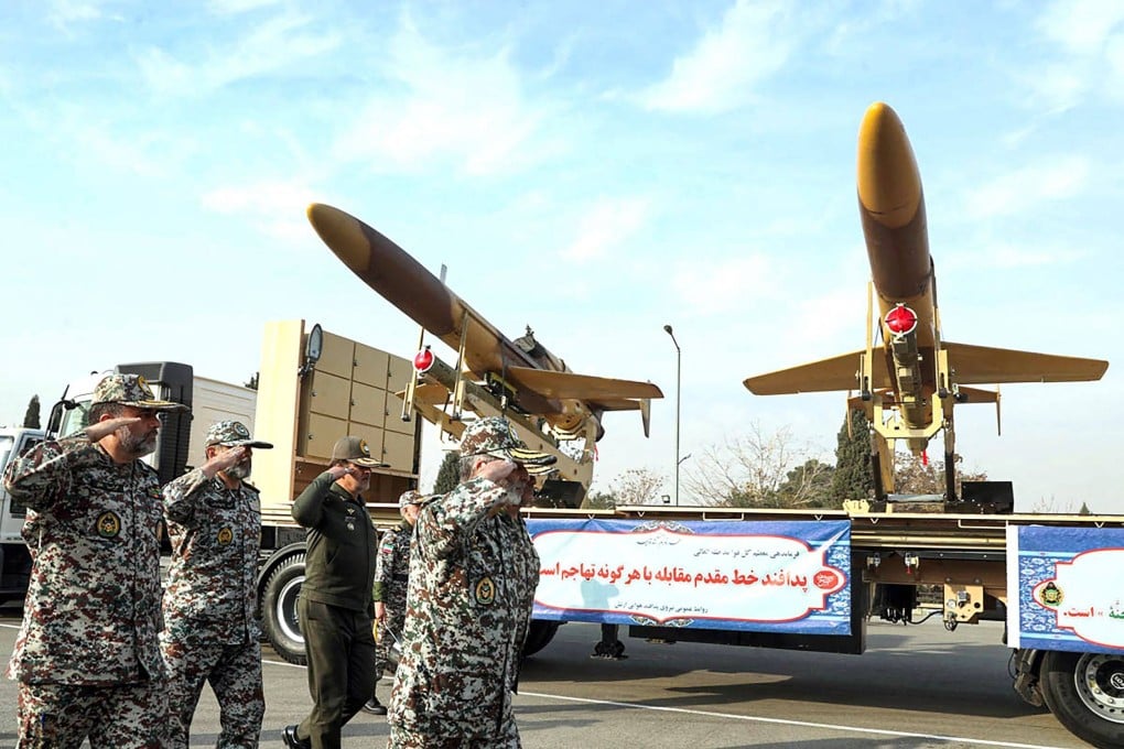 An image released on December 10 shows Iranian army officials inspecting Karrar drones displayed during an event in Tehran. Photo: Iranian Army office via AFP