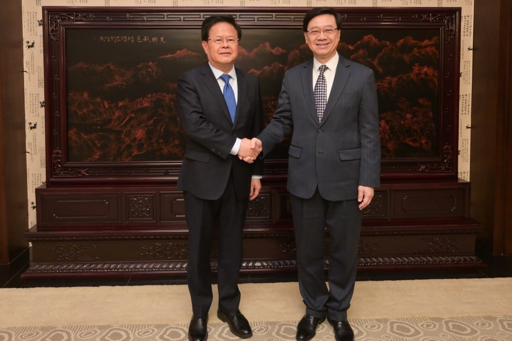 National Development and Reform Commission chairman Zheng Shanjie (left) meets John Lee in Beijing. Photo: Handout