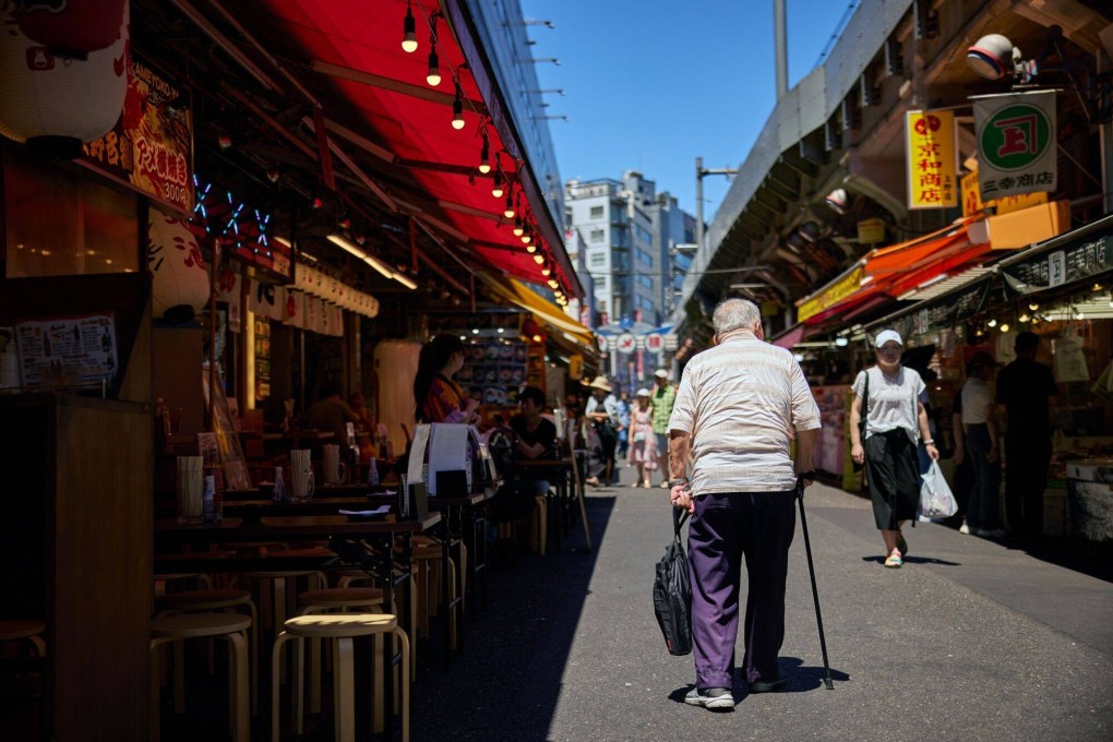 Shoppers in the Ueno area of Tokyo. The coronavirus pandemic had stretched the nation’s healthcare system close to breaking point and there was inadequate help available for people being cared for at home. Photo: Bloomberg