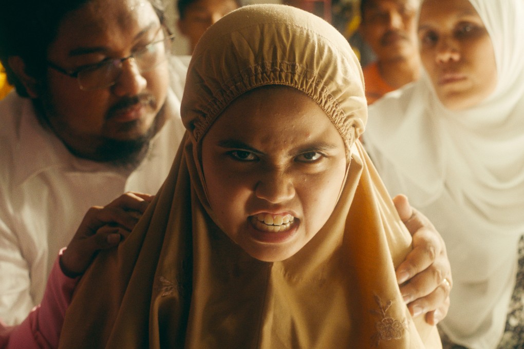 Zafreen Zairizal (centre) in a still from the Malaysian film Tiger Stripes. Photo: Ghost Grrrl Pictures