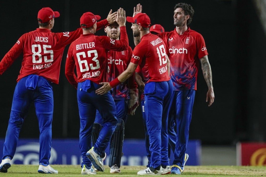 England players celebrate the dismissal of West Indies’ Matthew Forde during the fourth T20 at Brian Lara Academy. Photo: AP