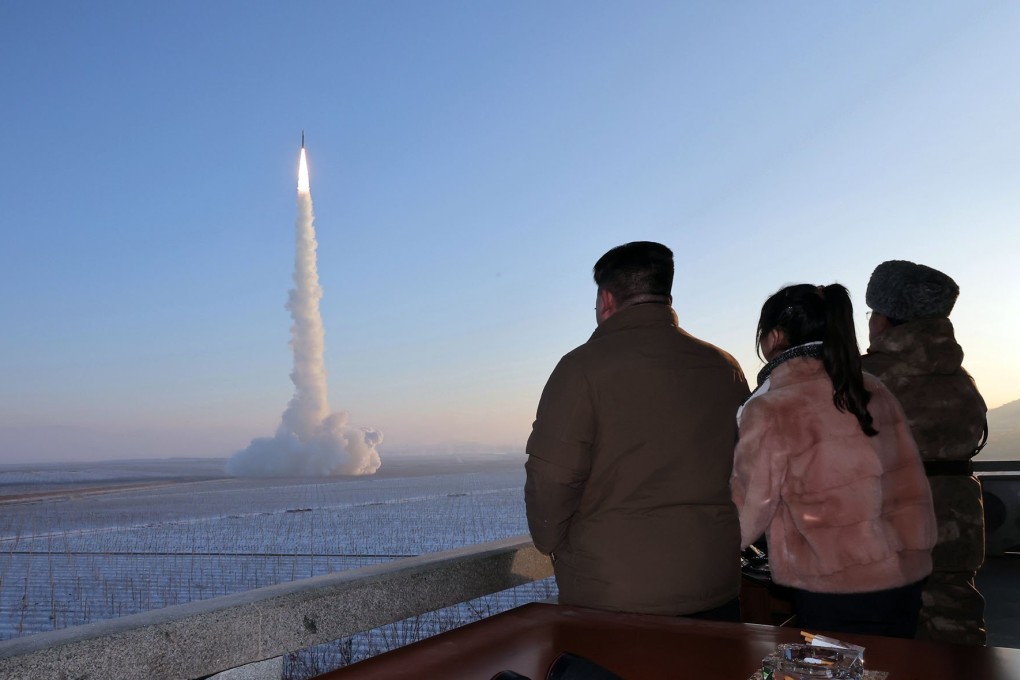 An image released by North Korean news agency KCNA shows the country’s leader, Kim Jong-un (left), and his daughter Kim Ju-ae (second left) watching a test launch of an intercontinental ballistic missile at an undisclosed location on Monday. Photo: KCNA/KNS/dpa