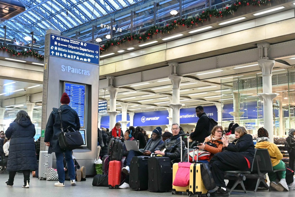 Passengers wait with their luggage at St Pancras station in London on Thursday as services are disrupted due to a Eurotunnel strike. Photo: AFP