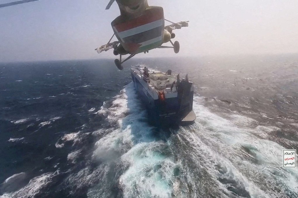 A Houthi military helicopter flies over the Galaxy Leader cargo ship in the Red Sea in a photo released November 20. Photo: Houthi Military Media/Reuters