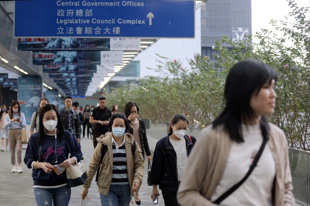 People near government offices in Admiralty. The civil service chief says government workers are not banned from expressing views on official policies or services. Photo: Xiaomei Chen