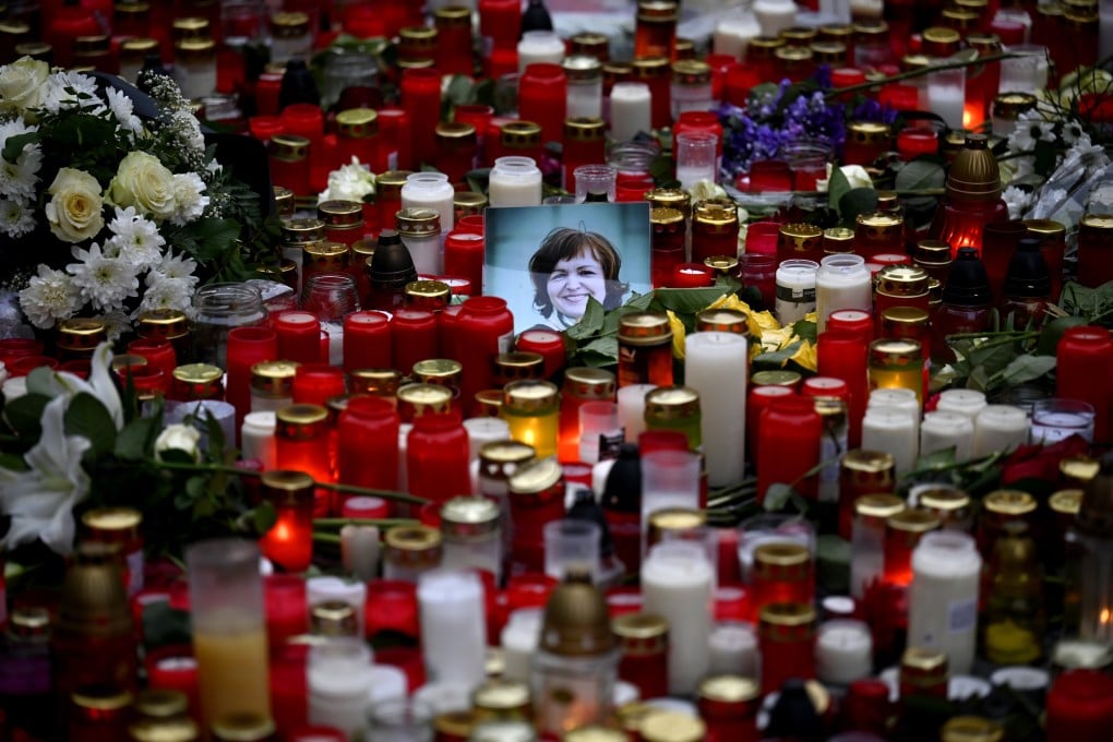 A view of floral tributes and candles outside the headquarters of Charles University in downtown Prague, Czech Republic, on Saturday. Photo: AP