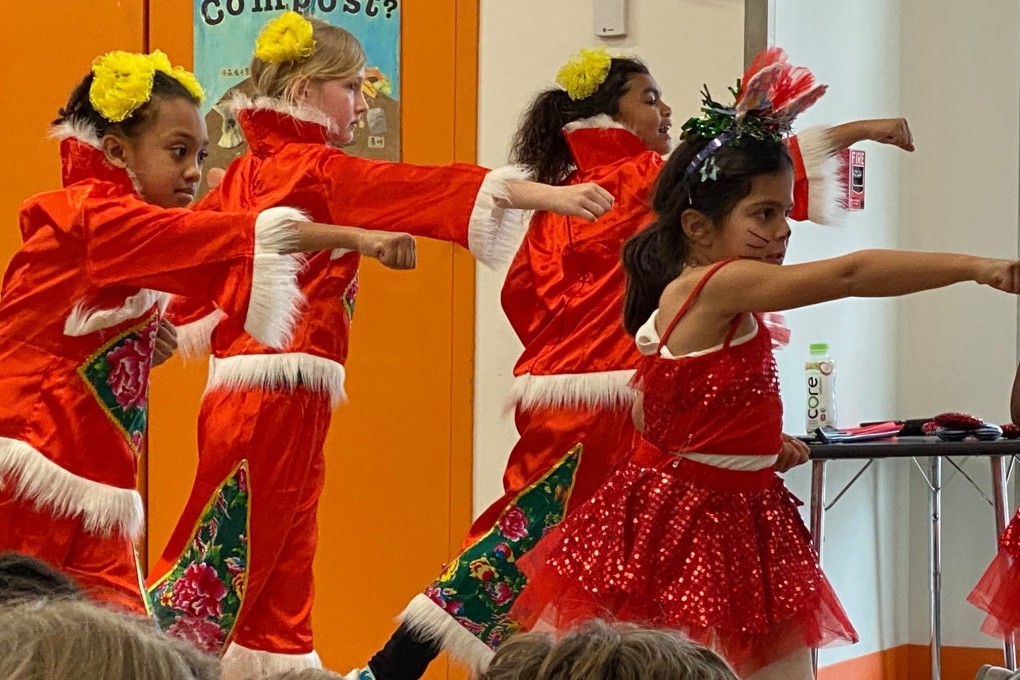 Yu Ying Public Charter School students in Washington DC perform a Chinese song and dance. Between public and private schools, Mandarin immersion programmes can be found in 32 US states. Photo: Yu Ying Public Charter School