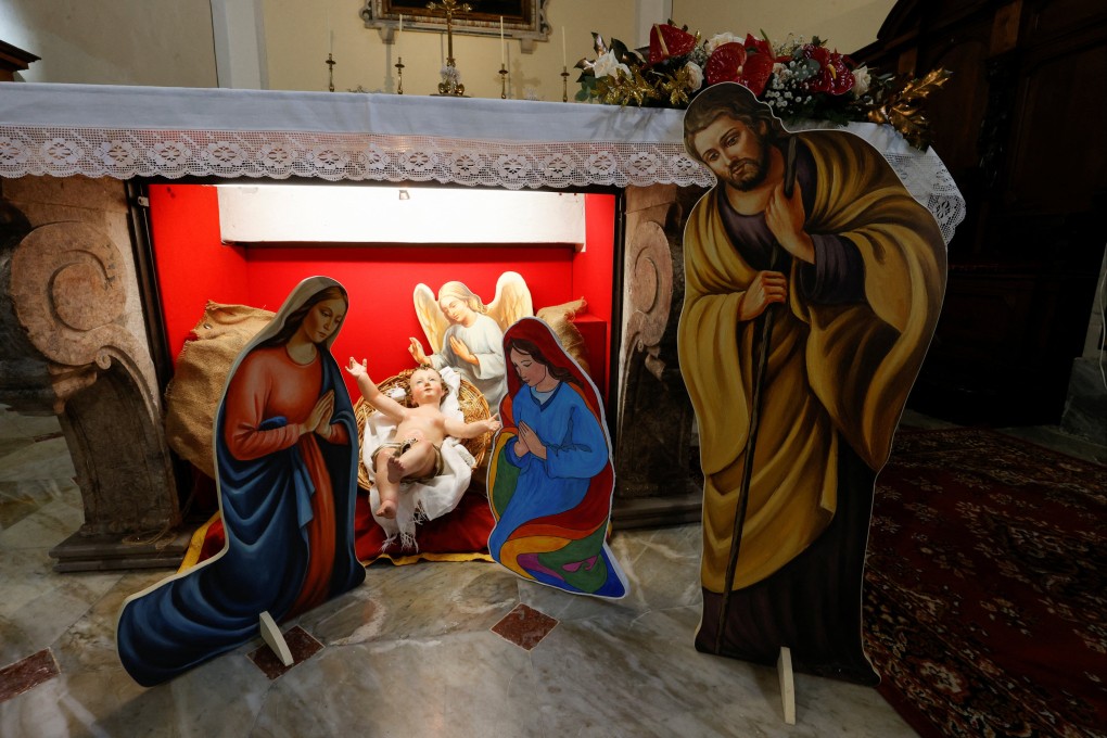 A nativity scene featuring two mothers of the Baby Jesus, instead of the conventional Mary and Joseph figurines, goes on display in the Church of Saints Peter and Paul in Capocastello di Mercogliano, Italy, on Saturday. Photo: Reuters