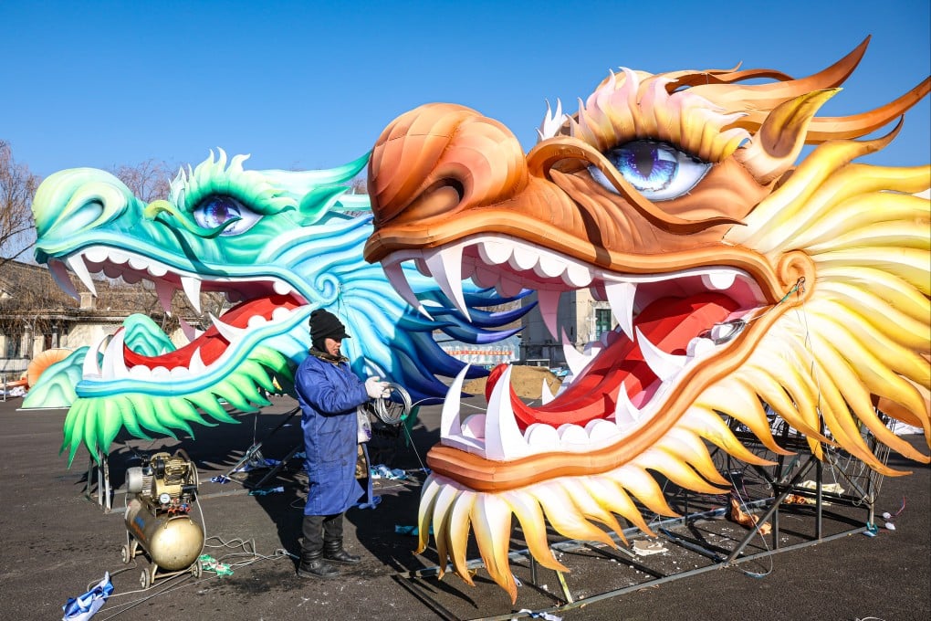 Craftsmen make dragon-shaped lanterns for a Lunar New Year lantern fair in Shenyang, China. Photo: Getty Images