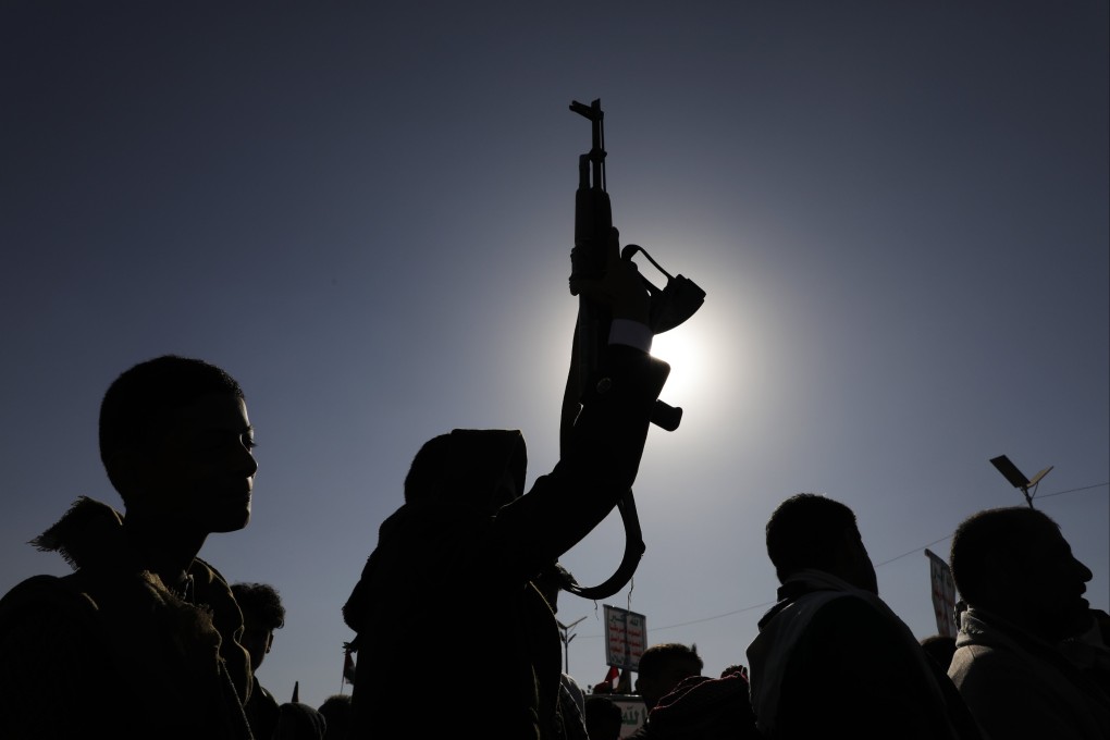 A man holds a gun during a protest in Sana’a, Yemen, on Friday. Photo: EPA-EFE