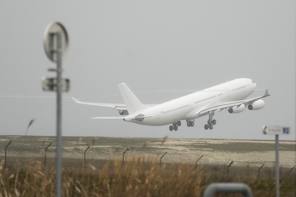 The plane grounded by police at France’s Vatry airport takes off on Monday. Photo: AP