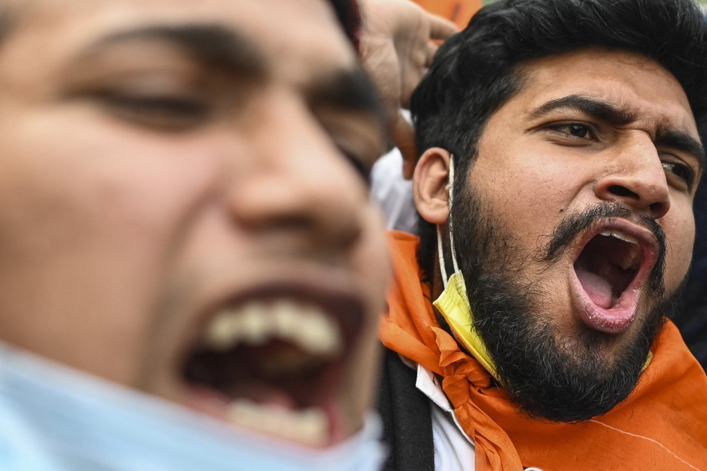 Activists from the Akhil Bharatiya Vidyarthi Parishad (ABVP) the student wing of the ruling Bharatiya Janata Party (BJP) shout slogans during a demonstration in New Delhi on January 31, 2022. Photo: AFP