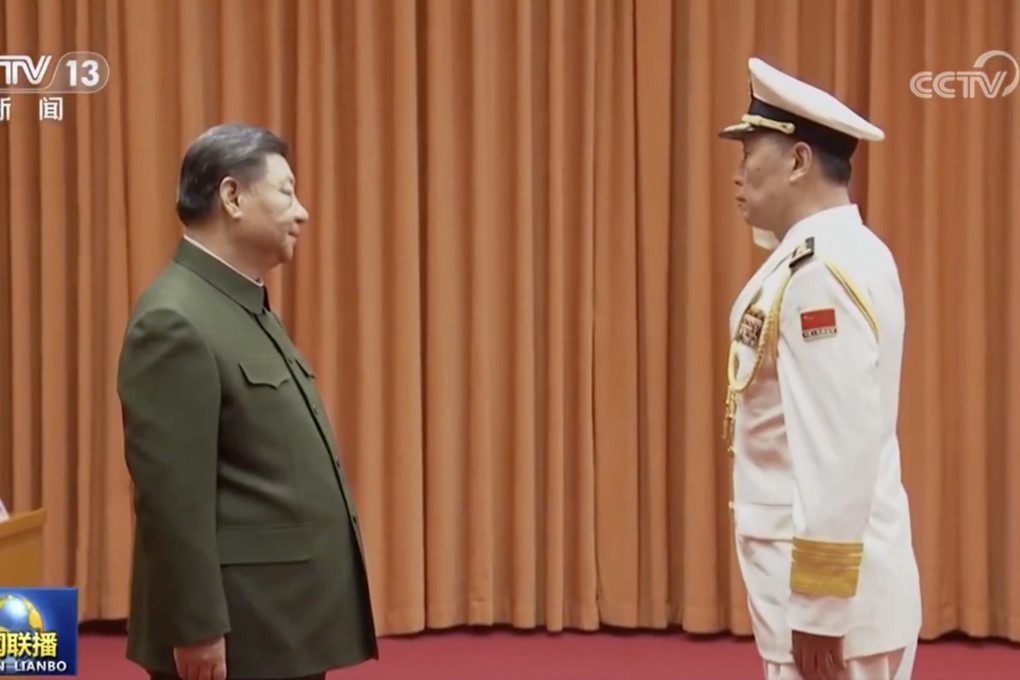 Chinese President Xi Jinping congratulates naval commander Hu Zhongming, commander of the navy, and Wang Wenquan, on his promotion to admiral. Photo: CCTV