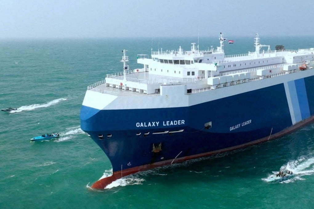 A cargo ship is escorted by Houthi boats following its capture in the Red Sea last month. Photo: Reuters