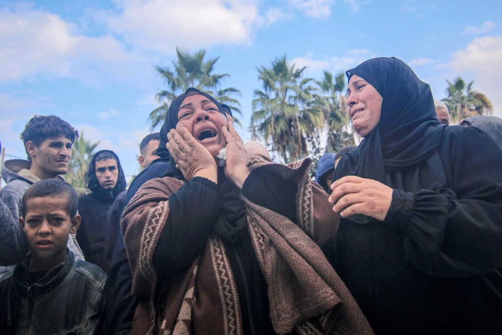Palestinians at Al-Aqsa Martyrs Hospital in Deir al-Balah mourn relatives killed during Israeli bombardment on the Maghazi camp on Monday. Photo: Bloomberg