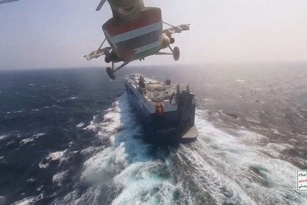 A Houthi military helicopter flies over the Galaxy Leader cargo ship in the Red Sea in this photo released by the group on November 20. Photo: Houthi Military Media/Handout via Reuters