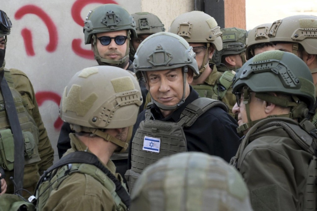 Israeli Prime Minister Benjamin Netanyahu receives a security briefing with commanders and soldiers in the northern Gaza Strip, on Monday. Photo: Avi Ohayon/GPO via Reuters