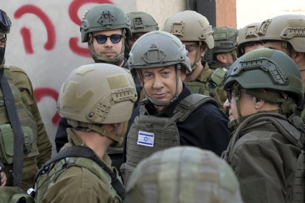 Israeli Prime Minister Benjamin Netanyahu receives a security briefing with commanders and soldiers in the northern Gaza Strip, on Monday. Photo: Avi Ohayon/GPO via Reuters