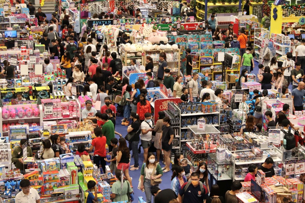 Buyers browse merchandise at a shopping centre on Orchard Road in Singapore. Photo: Reuters