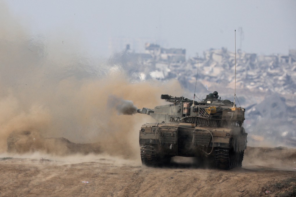 An Israeli tank firing towards Gaza on Wednesday. Photo: Reuters