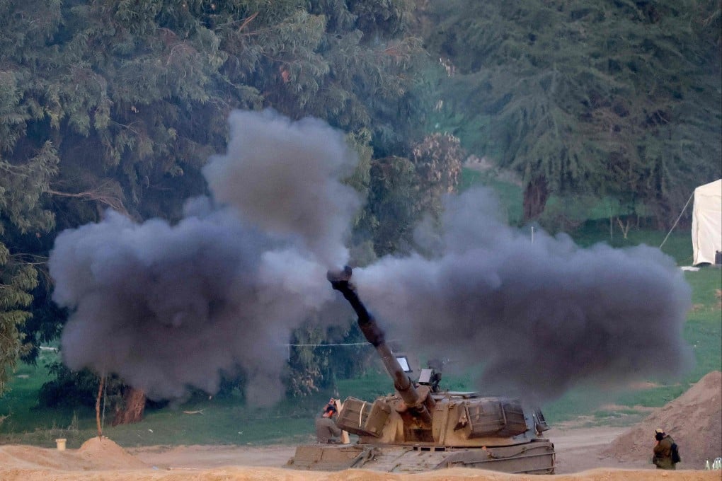 An Israeli army self-propelled artillery howitzer fires rounds from a position near the Gaza border. Photo: AFP