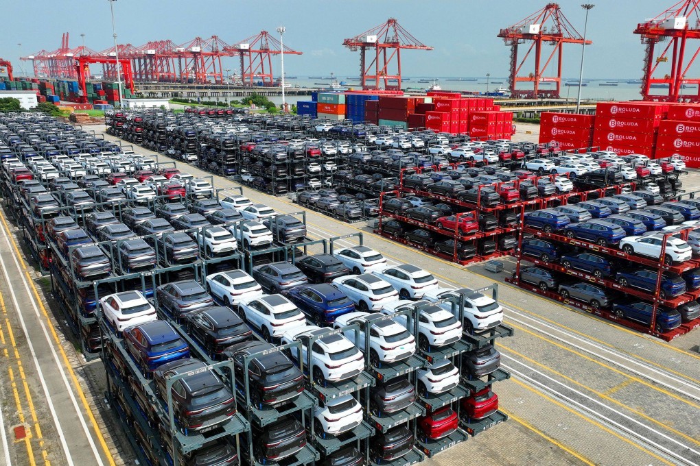 BYD electric cars are lined up waiting to be shipped from China’s Suzhou Port on September 11. Chinese brands now account for about half of EVs sold globally. Photo: AFP