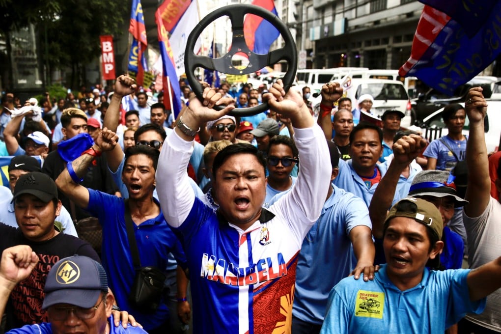 Jeepney drivers shout slogans as they stage a protest rally during a transport strike in Manila on December 29. Photo: EPA-EFE