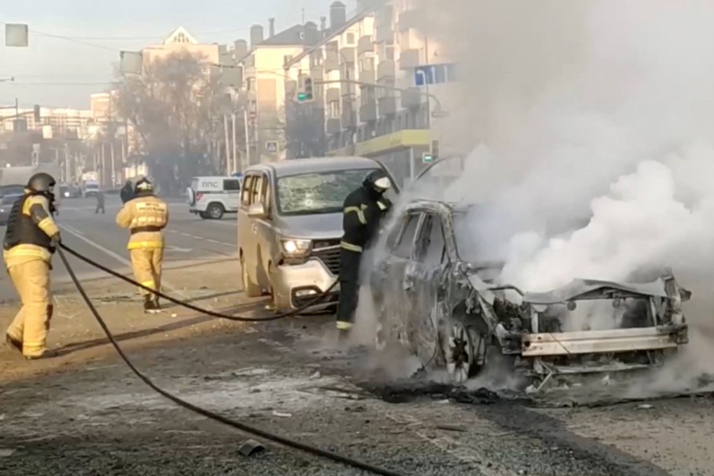 Firefighters extinguish a burning car following what was said to be Ukrainian forces’ shelling in Belgorod, Russia. Photo: Reuters