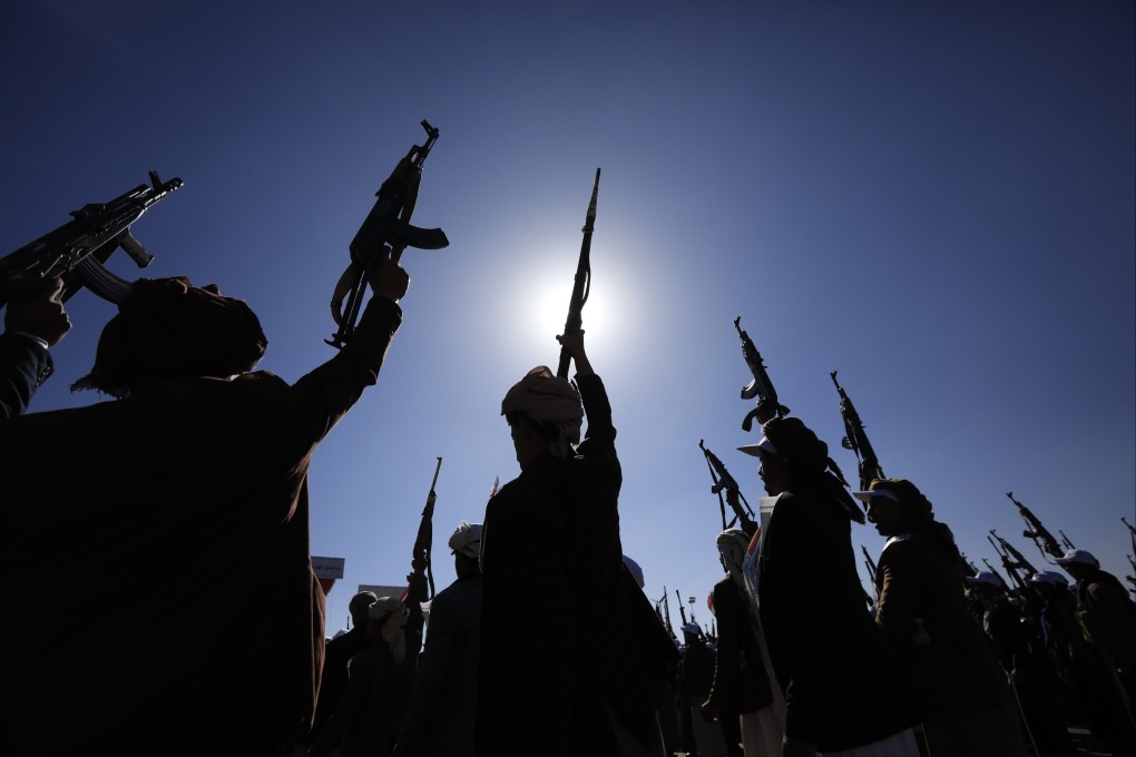 Newly-recruited members of the Houthis’ popular army hold up weapons during a parade in Sana’a, Yemen. The Iran-backed Houthis have claimed attacks on ships in the Red Sea that they say are either linked to Israel or heading to Israeli ports. Photo: EPA-EFE