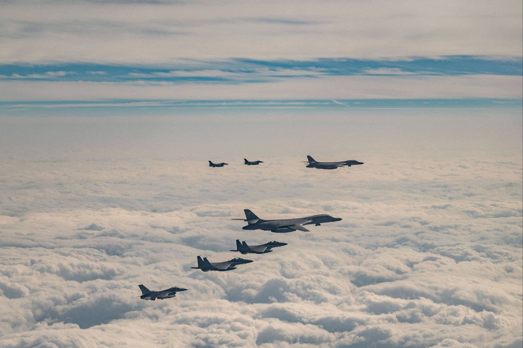 US, South Korean and Japanese air force bombers and fighter jets flying in formation in the eastern airspace of the South Korean island of Jeju during a joint air drill on December 20, 2023. Photo: Handout/South Korean Defence Ministry/AFP