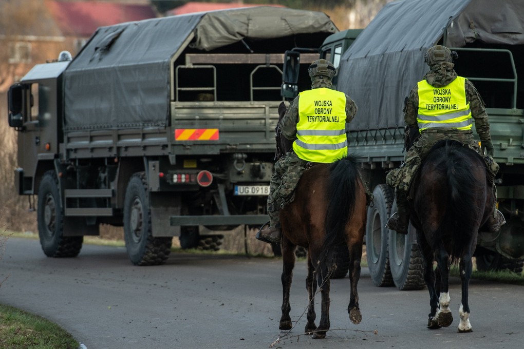 Polish Territorial Defence Forces’ mounted soldiers search for possible elements of an object that entered Poland’s airspace, near Wozuczyn, Tomaszow County, eastern Poland on Saturday. Photo: EPA-EFE