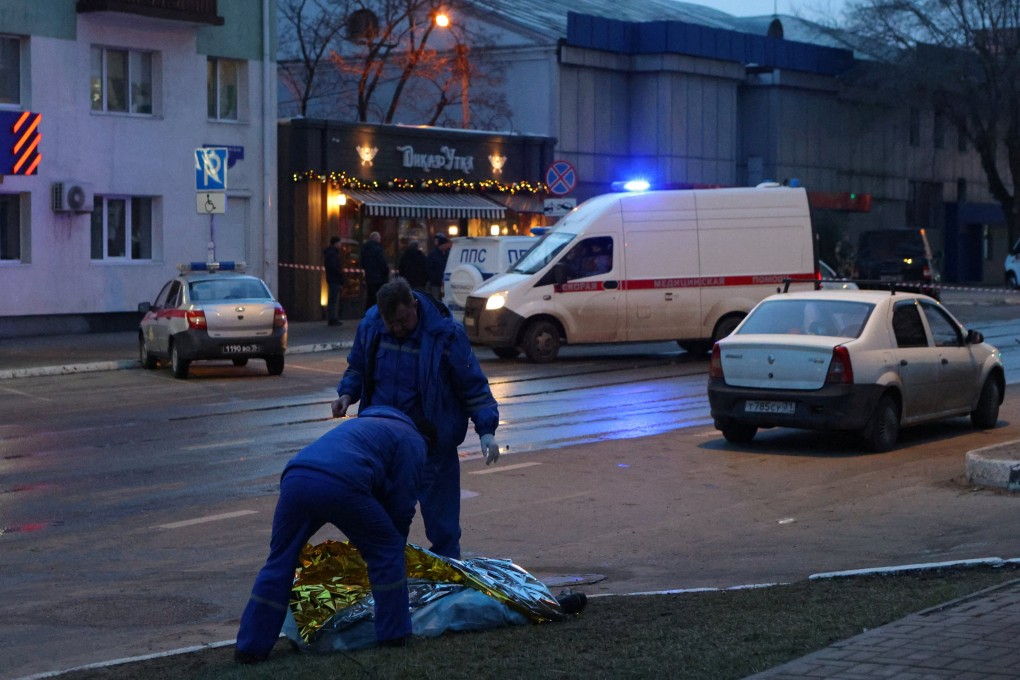 Paramedics cover the body of a victim following what Russian authorities say was a Ukrainian military strike in Belgorod, Russia on Saturday. Photo: Reuters