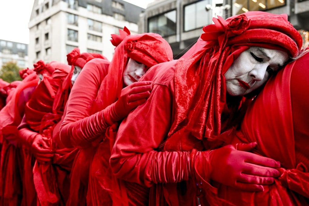 Environmental activists protest over the East African Crude Oil Pipeline at the TotalEnergies office in Brussels last month. The oil company has a 62 per cent interest in the pipeline. Photo: EPA-EFE