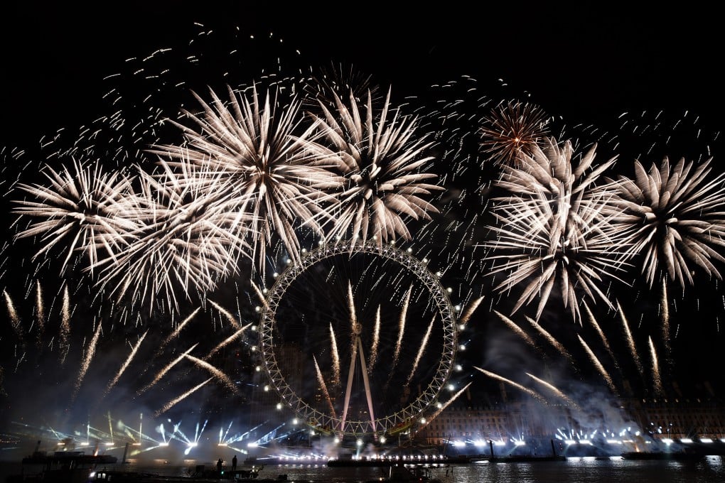 Fireworks light-up the sky over the London Eye in central London. Photo: AP