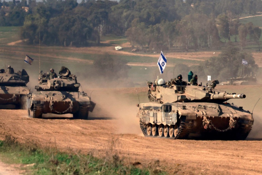 Israeli tanks roll back from the Gaza Strip on Sunday. Photo: AFP
