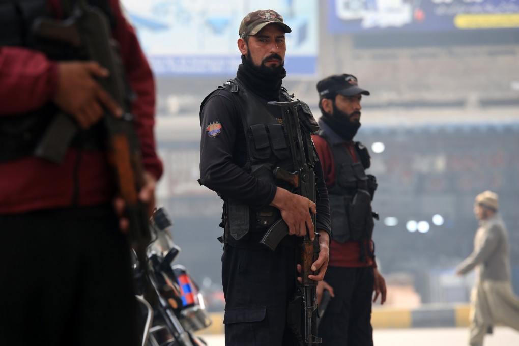 Pakistani security personnel wait at a checkpoint in Peshawar in December following deadly attacks by militants targeting soldiers and police. Photo: EPA-EFE