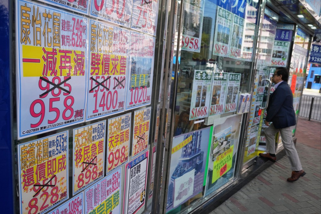 Price adjustments are seen in property advertisements at an agency in Quarry Bay, Hong Kong, on November 2, 2023. Photo: Elson Li