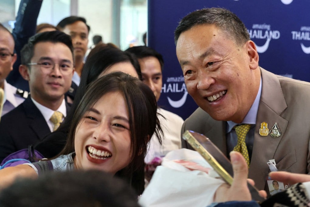 A Chinese tourist takes a selfie with Thailand’s Prime Minister Srettha Thavisin during a welcome ceremony in September last year for the first batch of Chinese tourists who arrived at Bangkok’s International Airport under a five-month visa-free entry scheme. Photo: Reuters