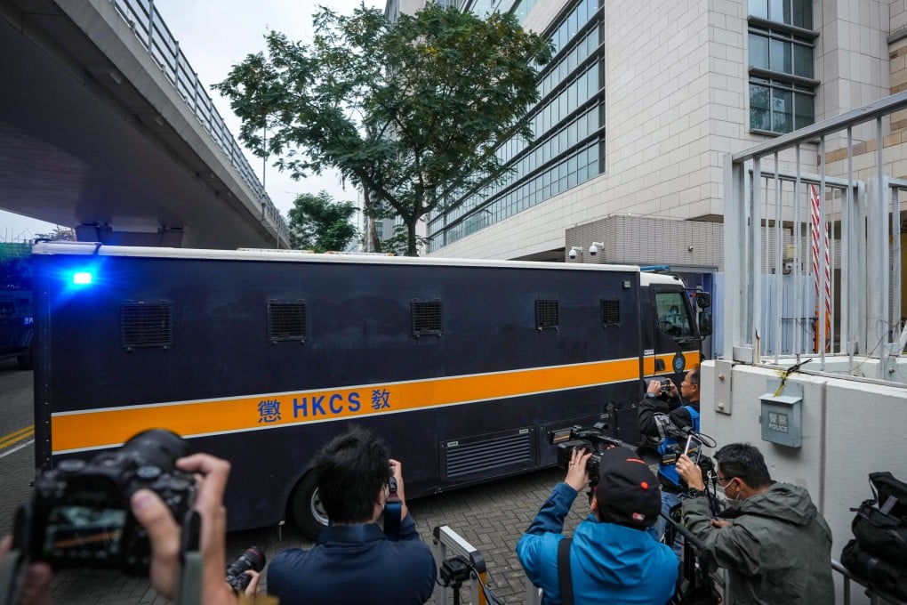 A prison van carrying Jimmy Lai arrives at West Kowloon Court. Police have been checking vehicles entering the building. Photo: Eugene Lee