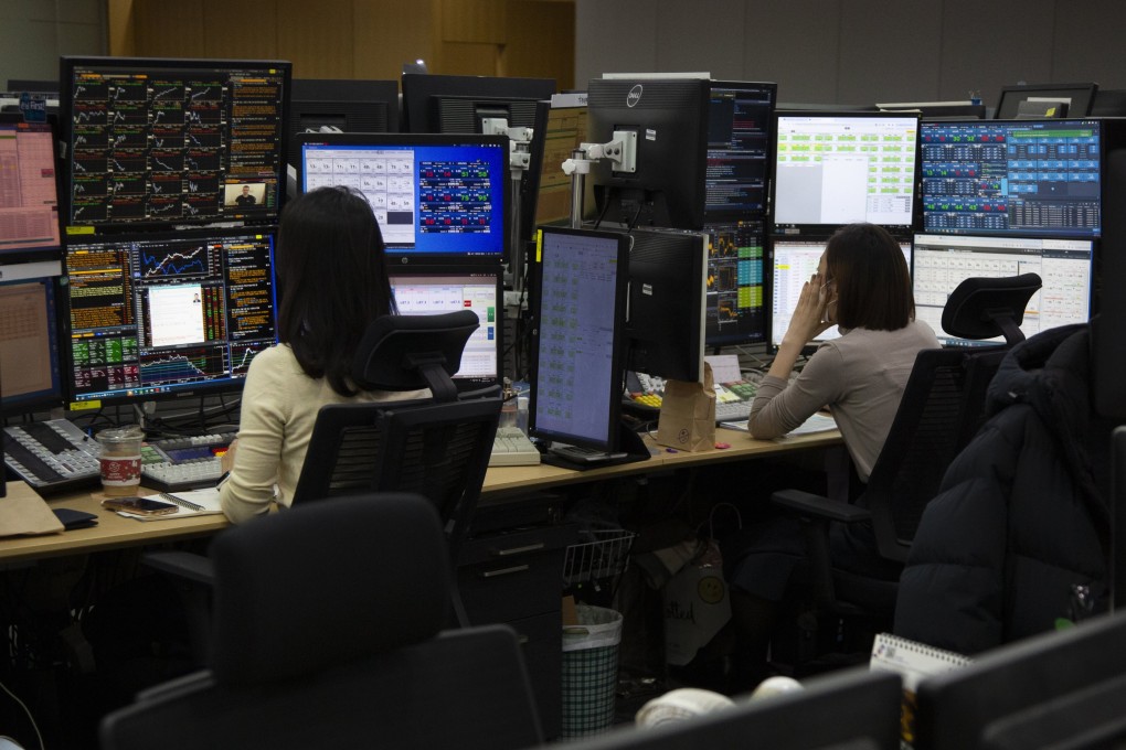 South Korean traders work in front of monitors at a bank in Seoul last month. Authorities said last year that they ultimately want the Korean won to trade 24 hours. Photo: EPA-EFE