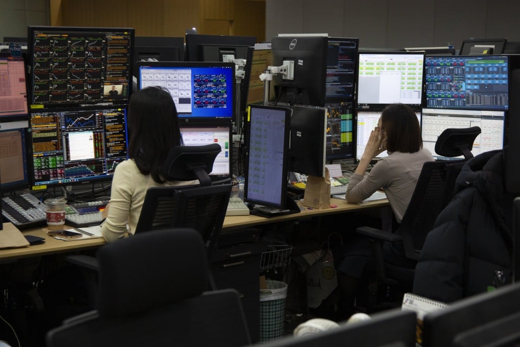South Korean traders work in front of monitors at a bank in Seoul last month. Authorities said last year that they ultimately want the Korean won to trade 24 hours. Photo: EPA-EFE